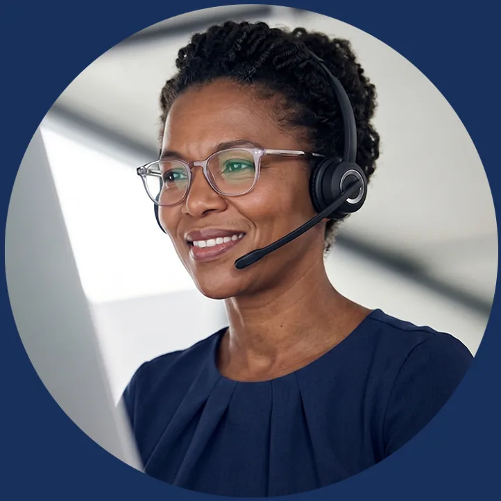 Drivalia corporate car hire adviser wearing a headset, ready to take business enquiries